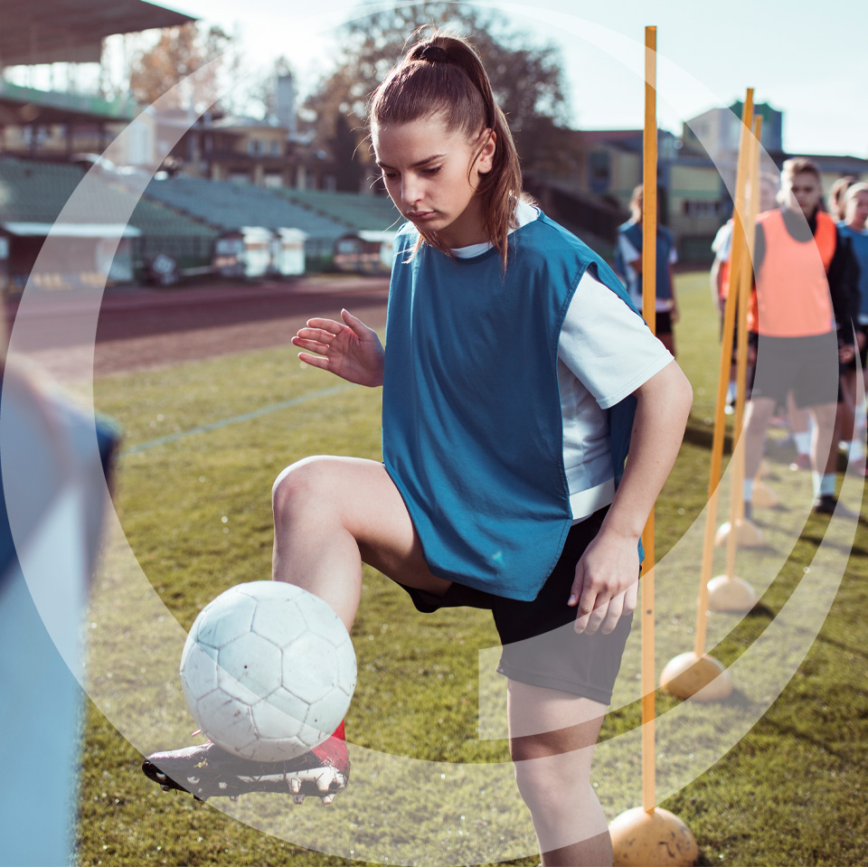 girl playing soccer